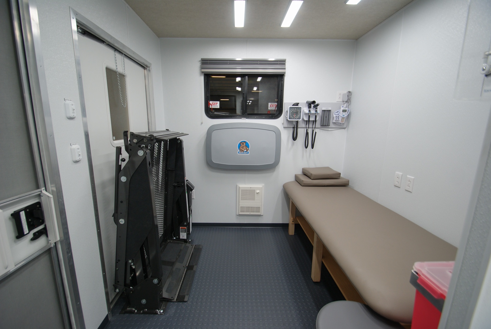 The exam area inside the Medical Exam 36FW trailer made for the OK Department of Health.