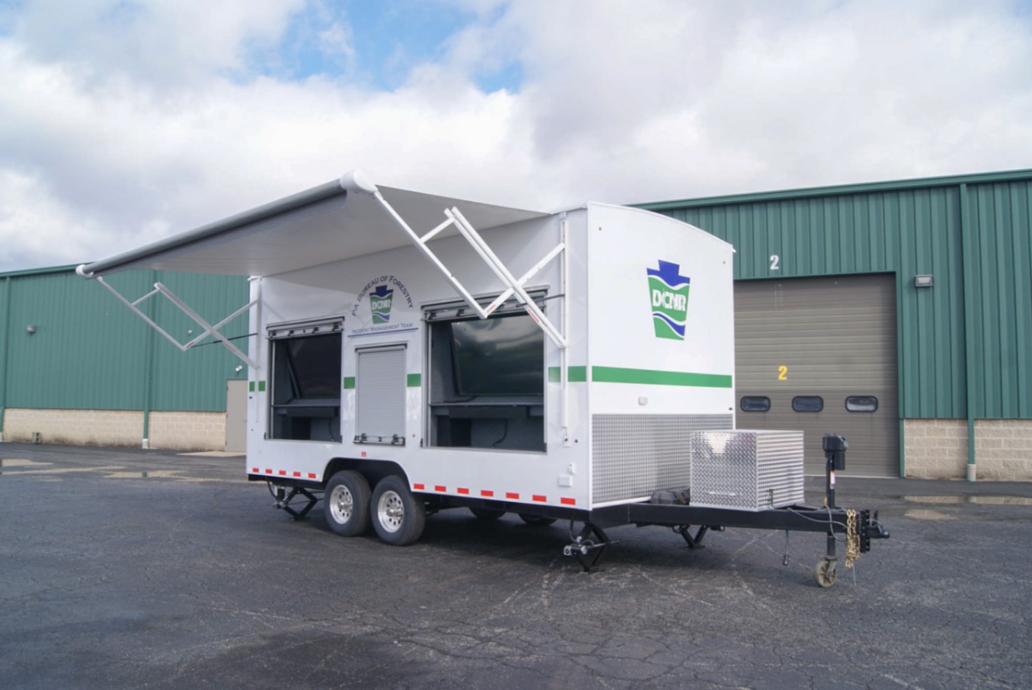 An exterior view of the upfitted Drone Observation Command trailer made for the PA DNCR. The awning is deployed.