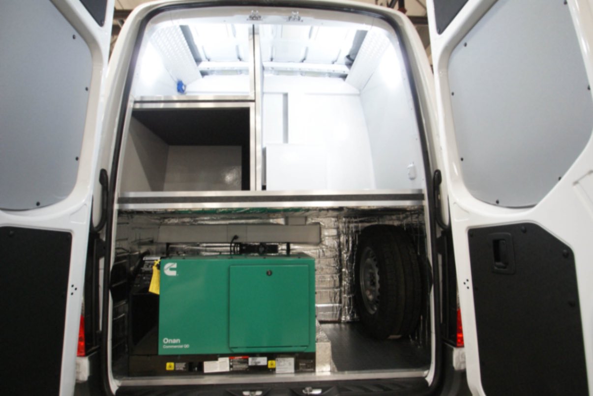 The rear storage space inside the Outreach Sprinter van made for Escondido, CA.