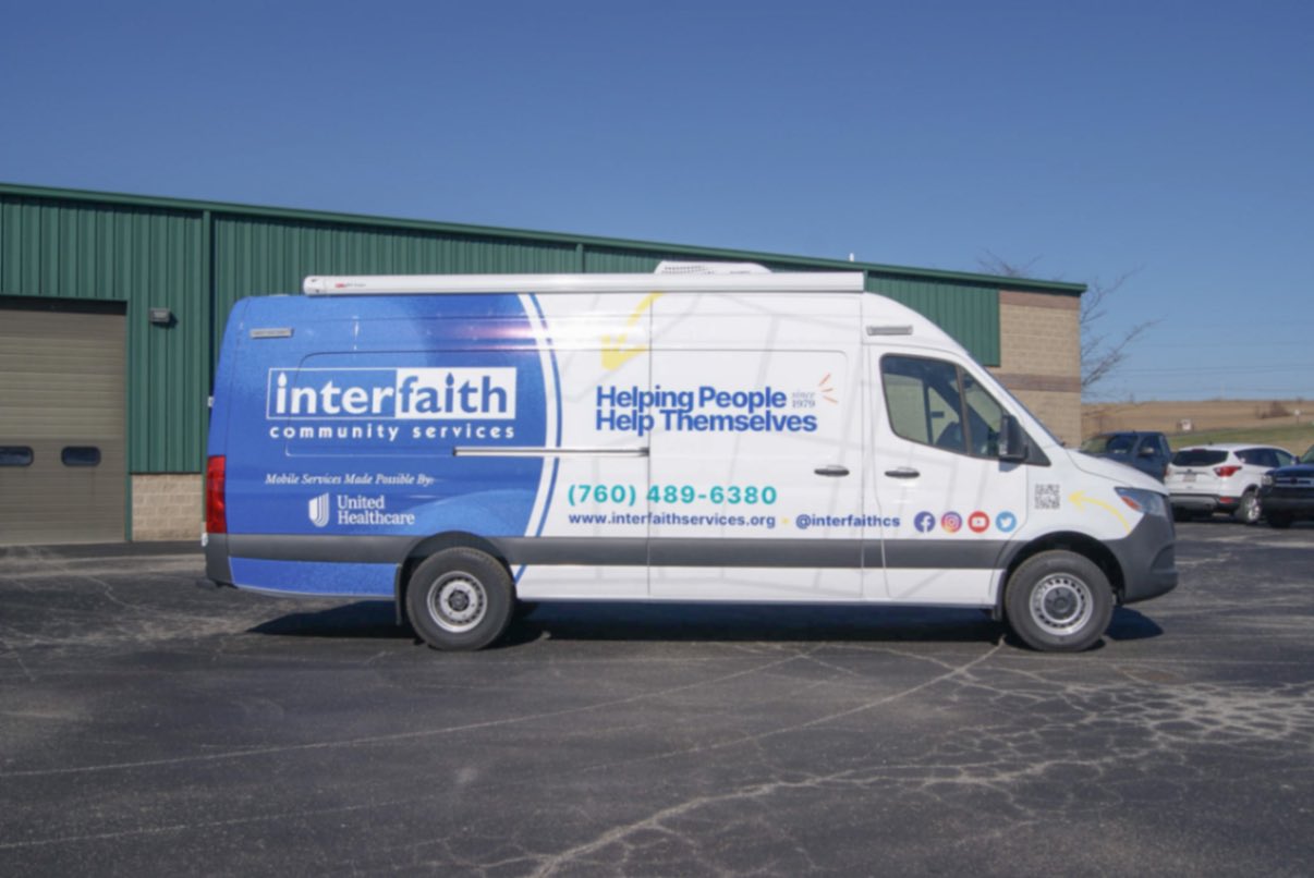 A side view of the Outreach Sprinter van made for Escondido, CA.