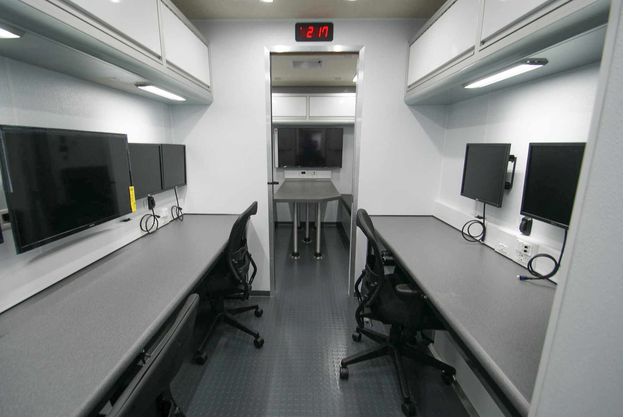 A view of 3 workstations and the conference room inside the unit for Delhi, NY.