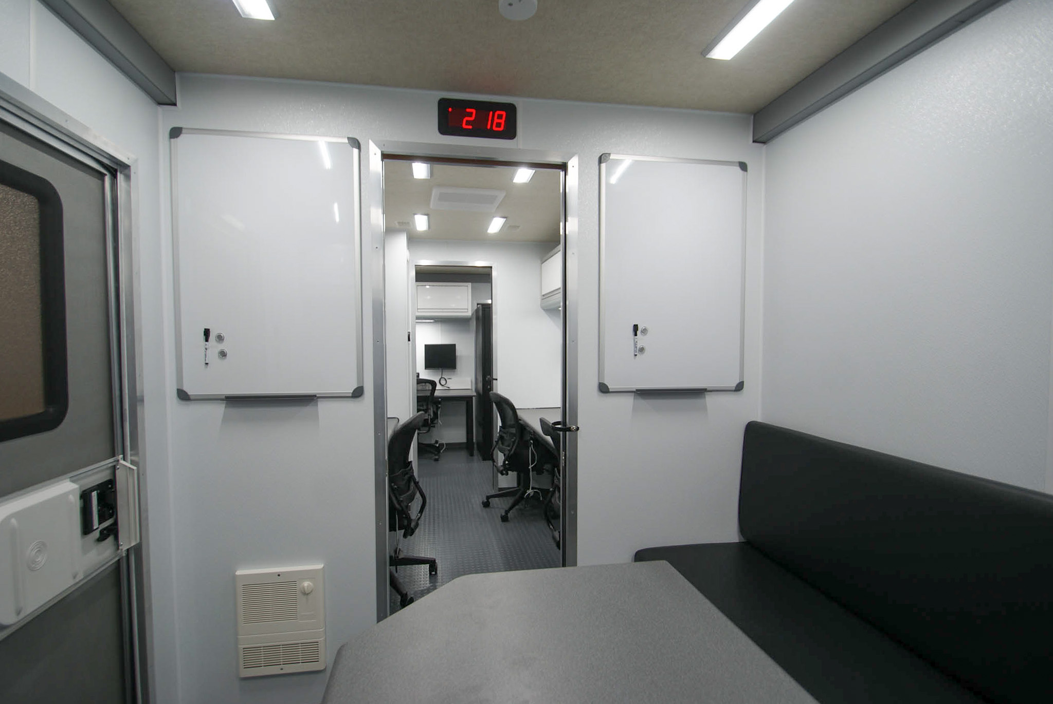 A view of the mounted whiteboards inside the conference room of the unit for Delhi, NY.