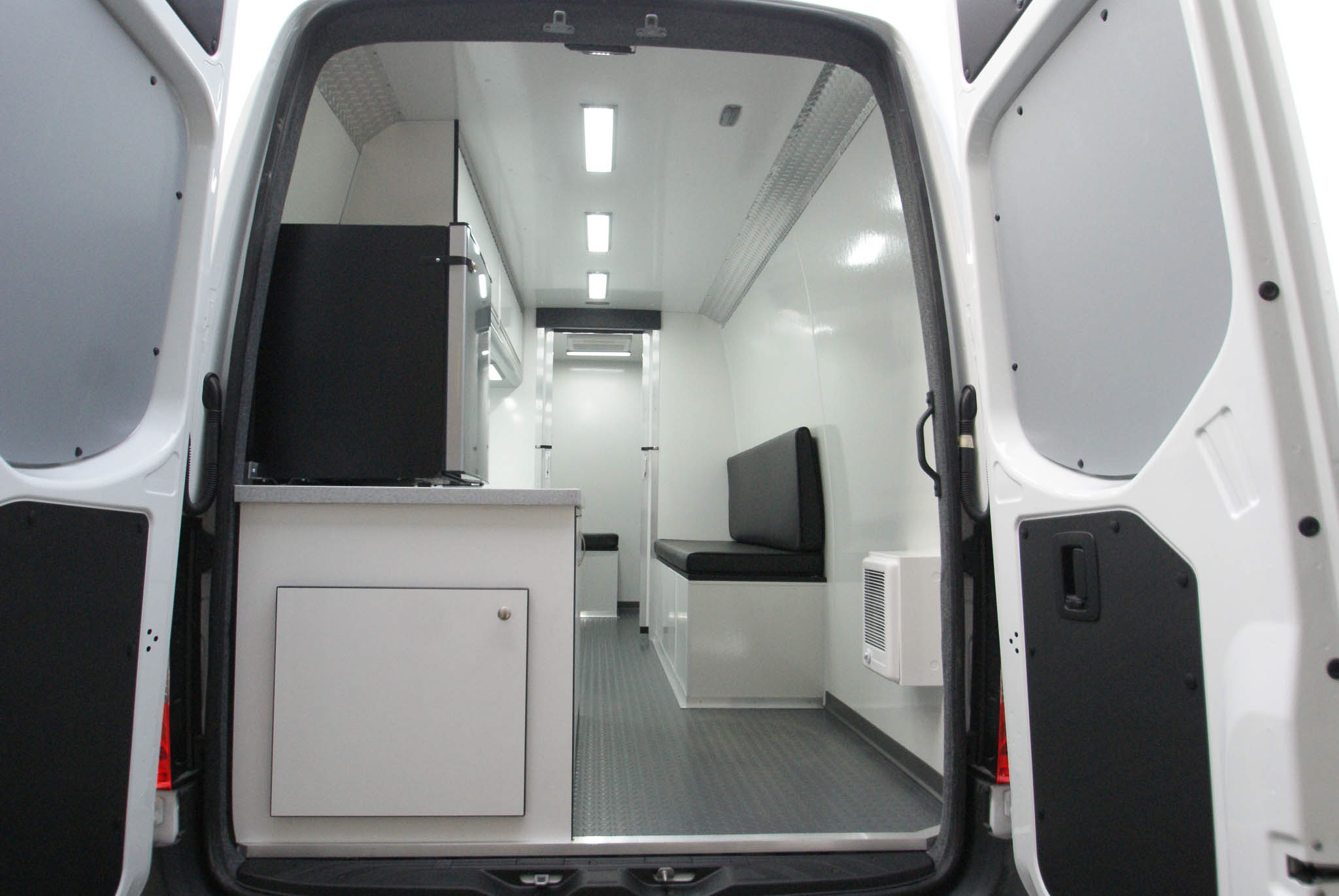 The direct view of the Mobile Outreach sprinter van's back room as viewed from the rear entrance.
