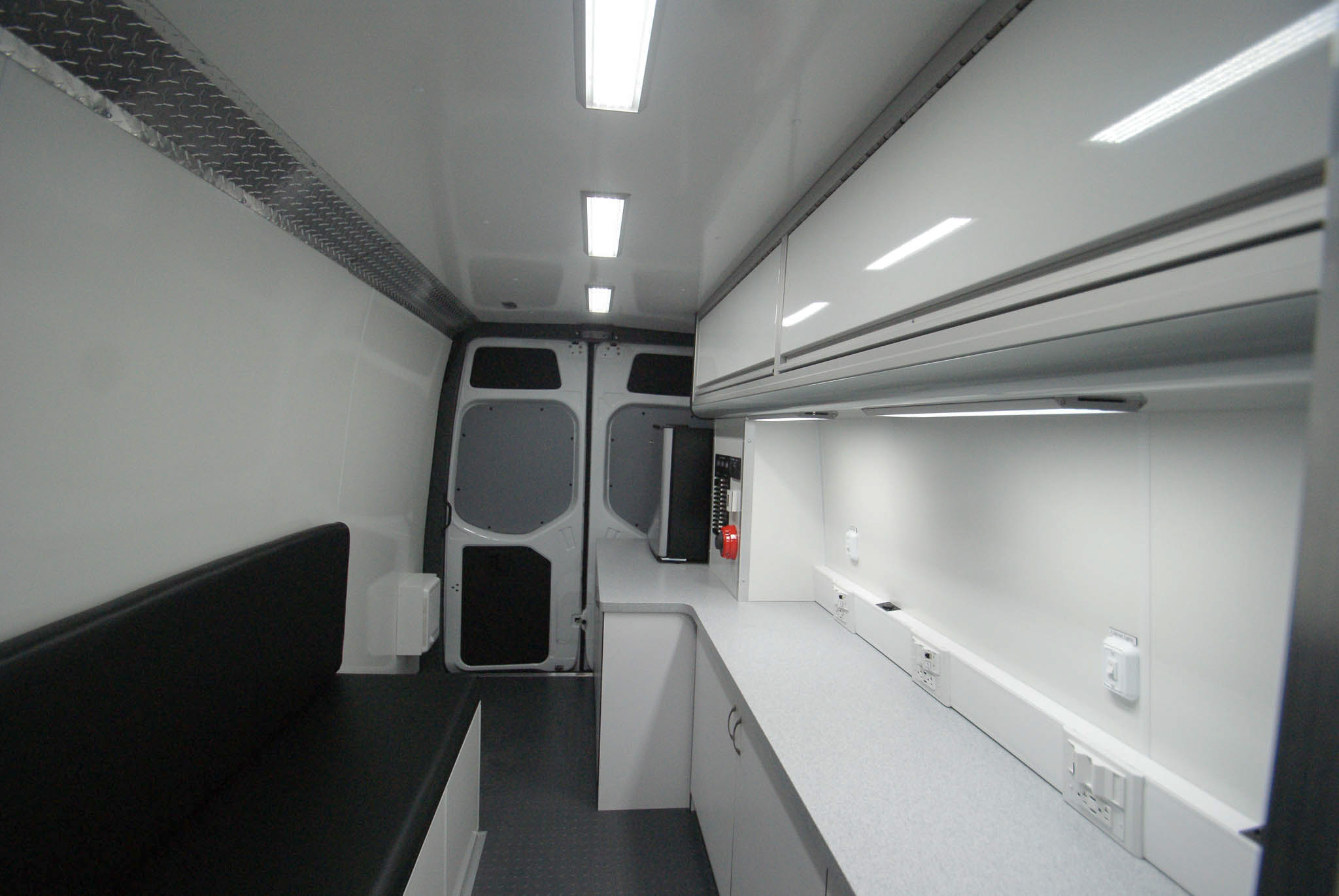 Direct view of the Mobile Outreach sprinter van's back room as seen from the waiting area.