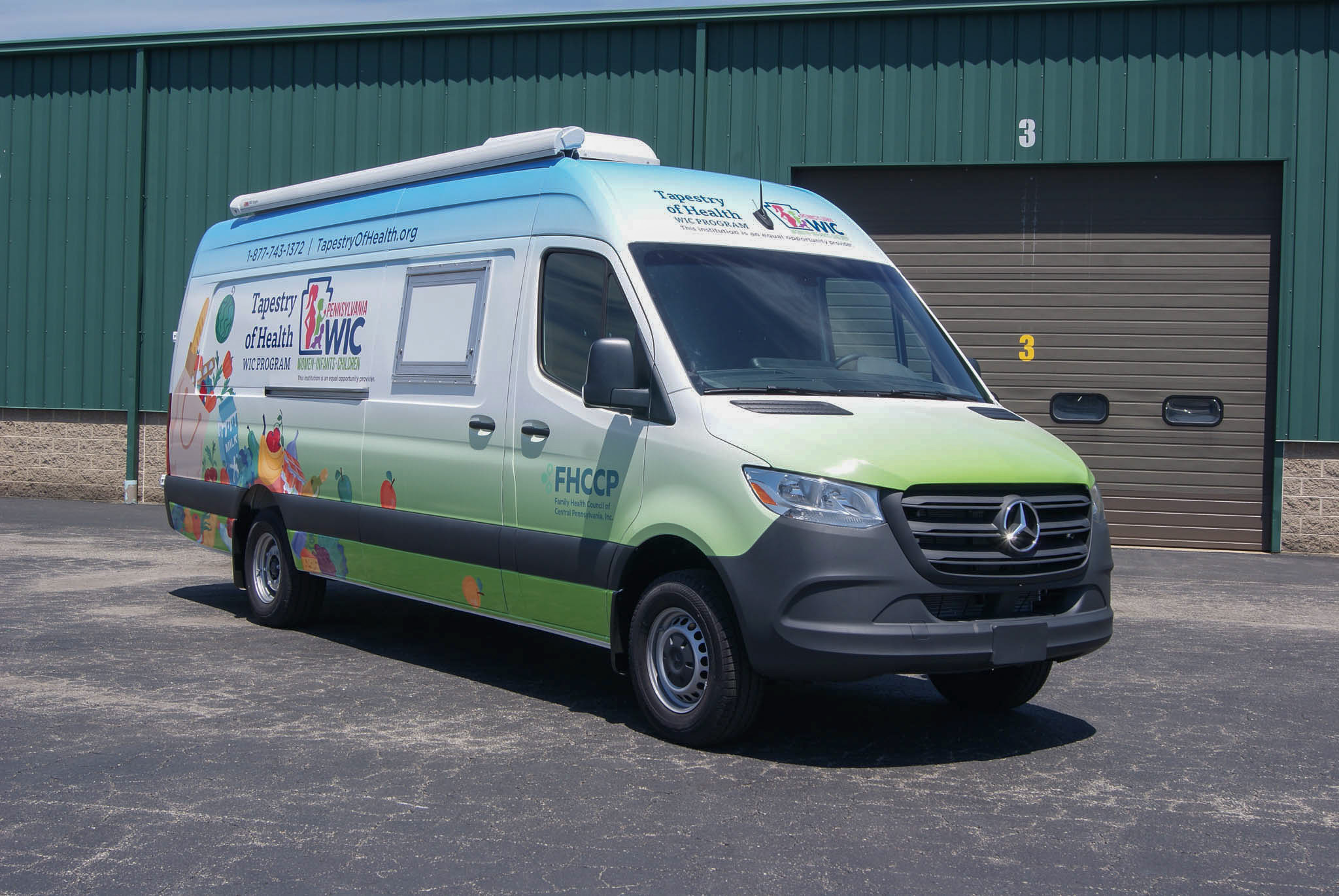 Angled view of the Mobile Outreach sprinter as viewed from the front.