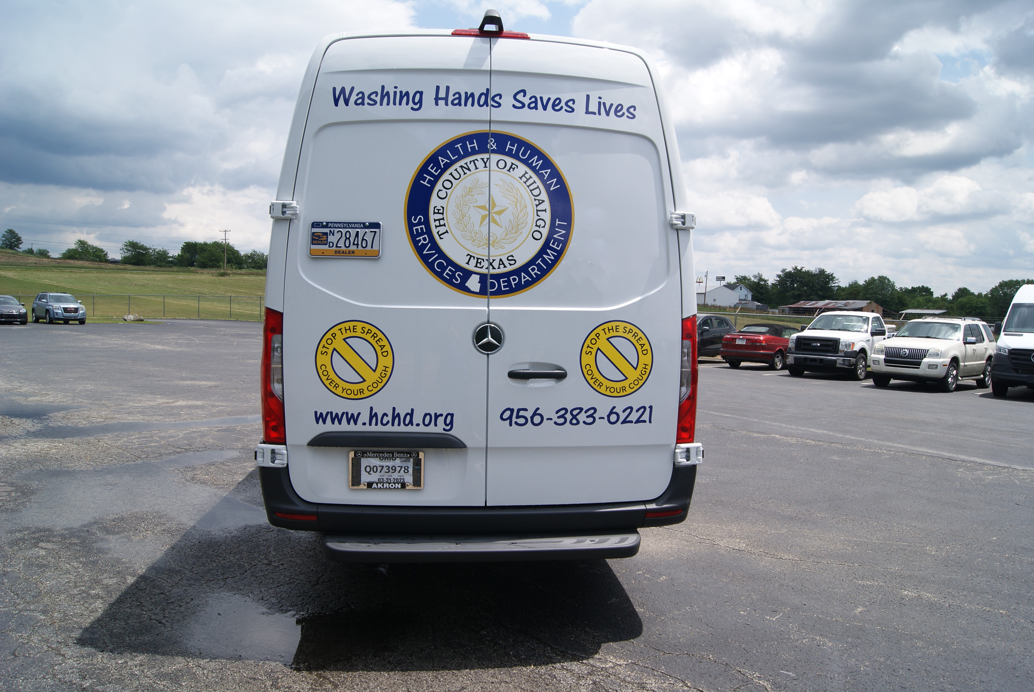 A direct view of the Mobile Medical Exam sprinter's back door decals.