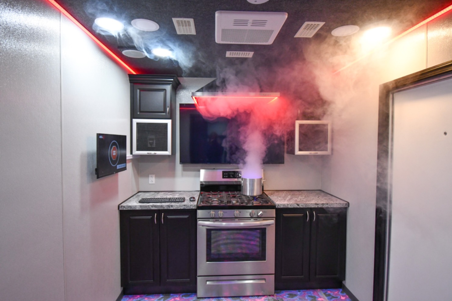 The kitchen stage inside the SCOTTY Safety Theater 35-Bedroom made for Merrillville, IN. The stove is smoking.