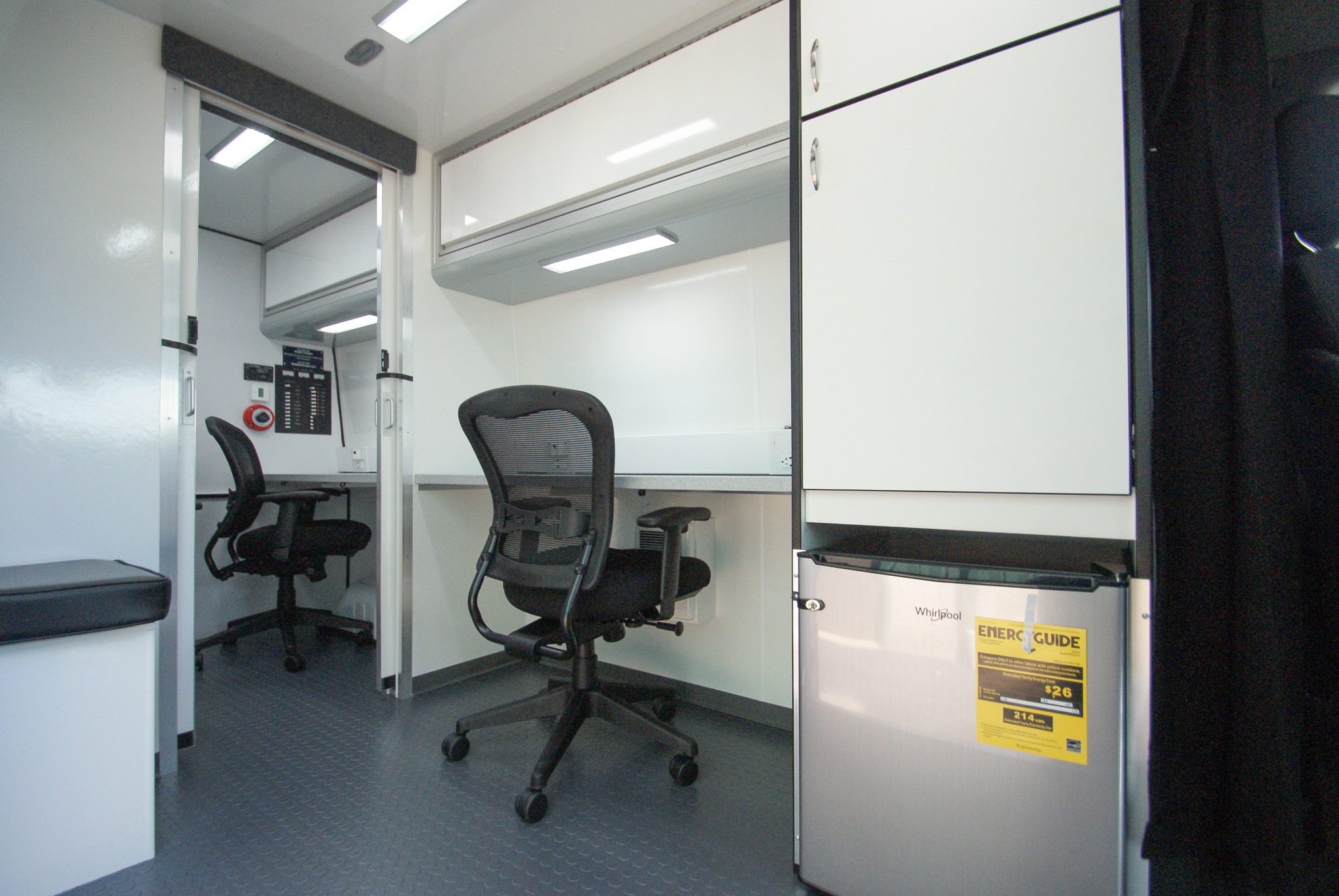 An alternate view of the workstation, cabinet, seat, and partial view of the clinic inside the units made for Talledaga, AL.