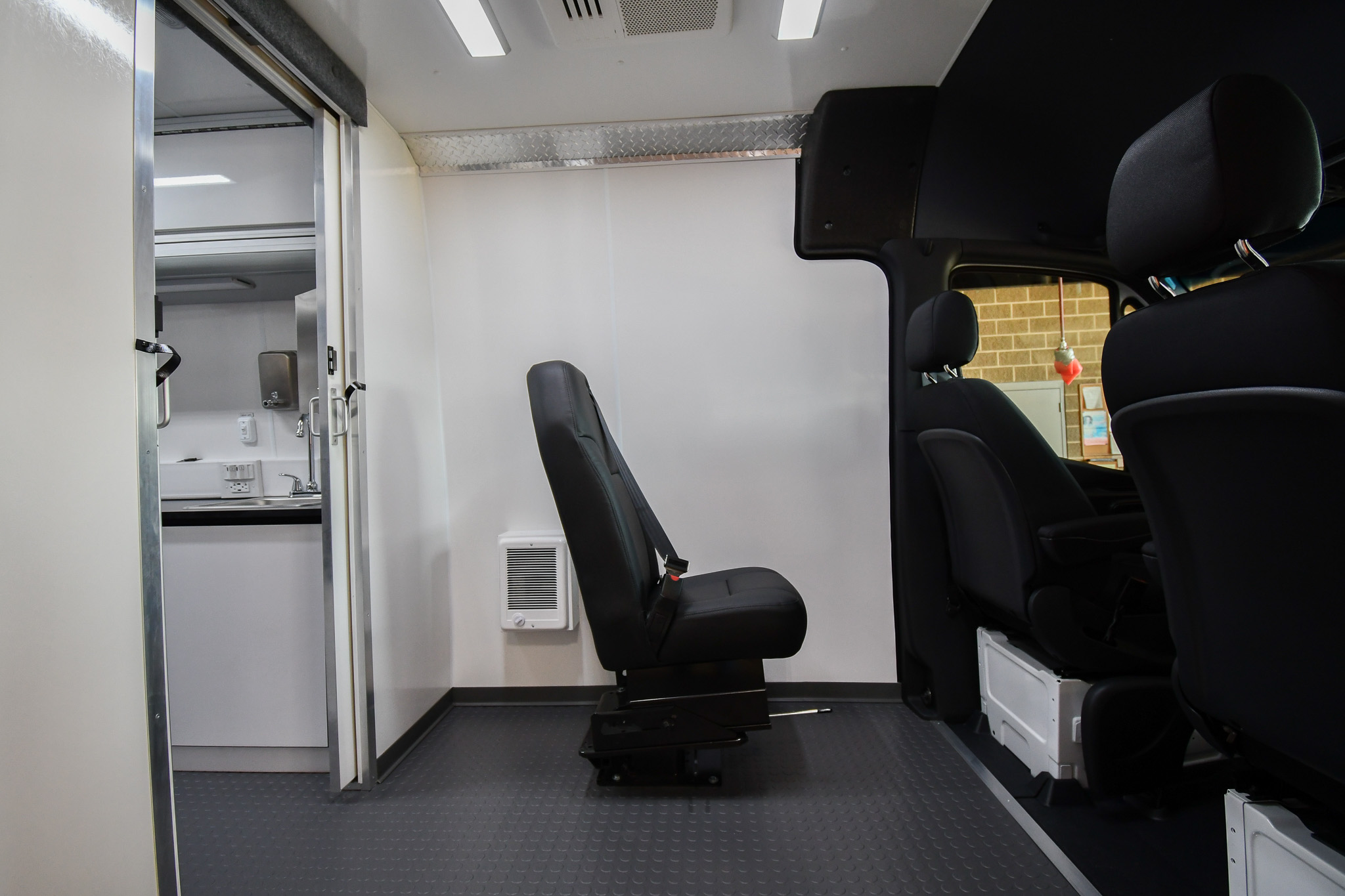 The mounted DOT seat behind the driver's seat inside the unit for Omaha, NE.