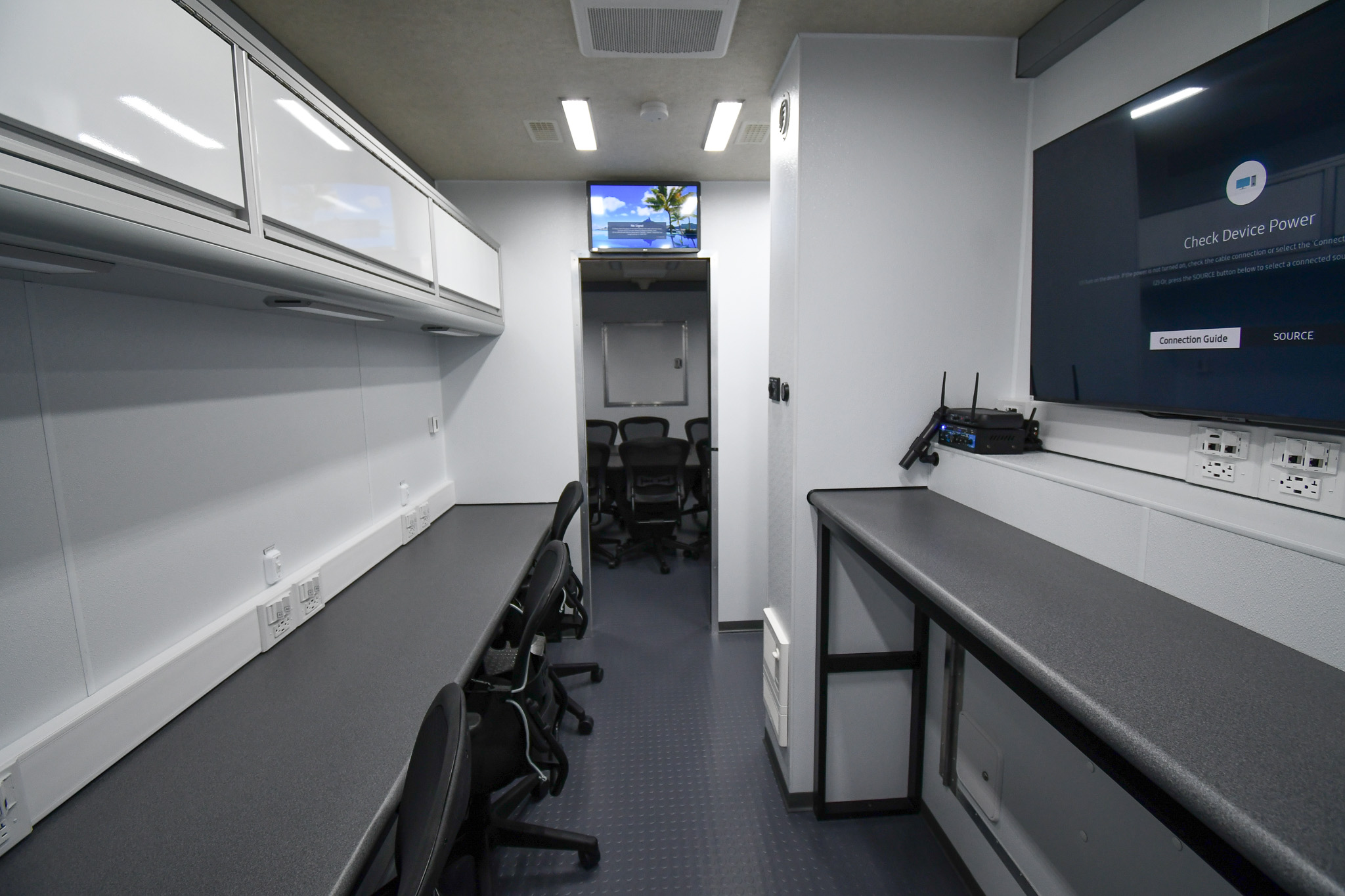 A closer view of the four workstations (one without a task chair) inside the unit for Montgomery County, TN.