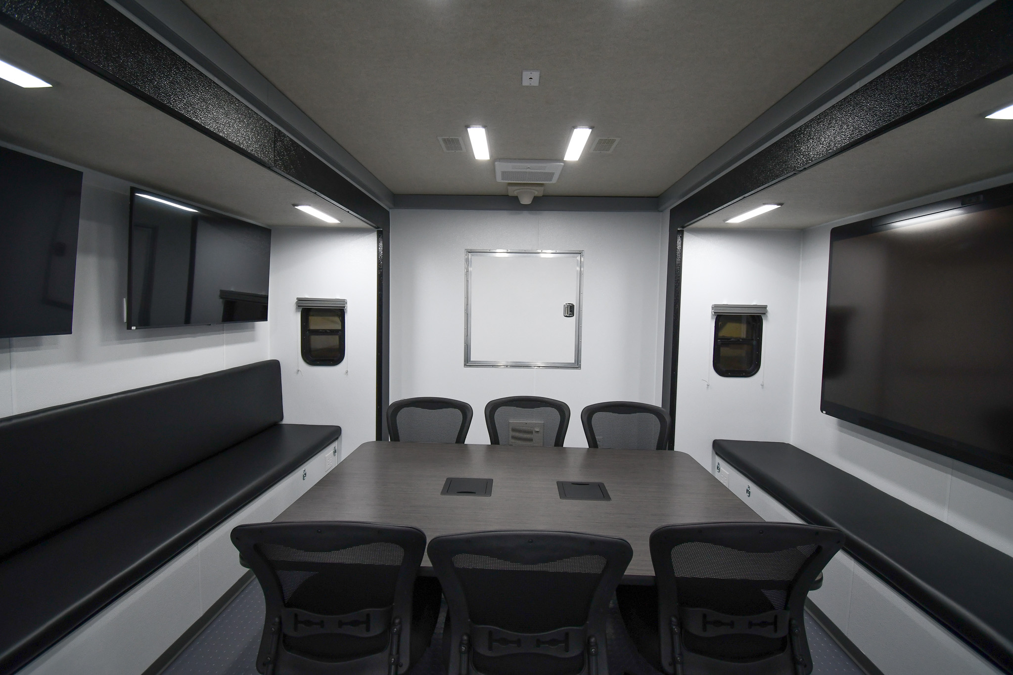 A view of the conference room and door to the 5th wheel storage area inside the unit for Montgomery County, TN.