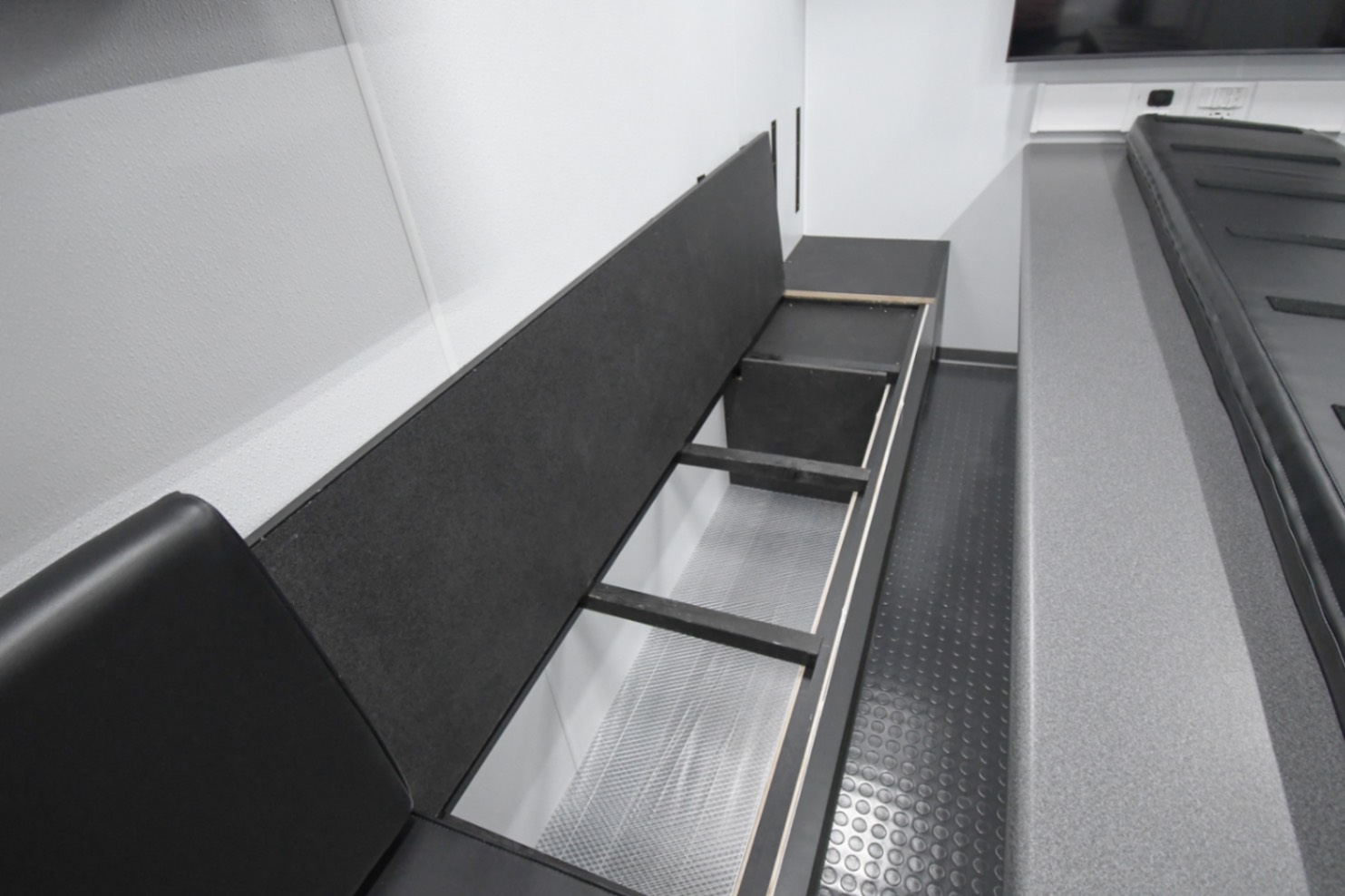 Storage space underneath the benches in the Command 31-4WS MOD's conference/work area. It was made for Winchester, VA.