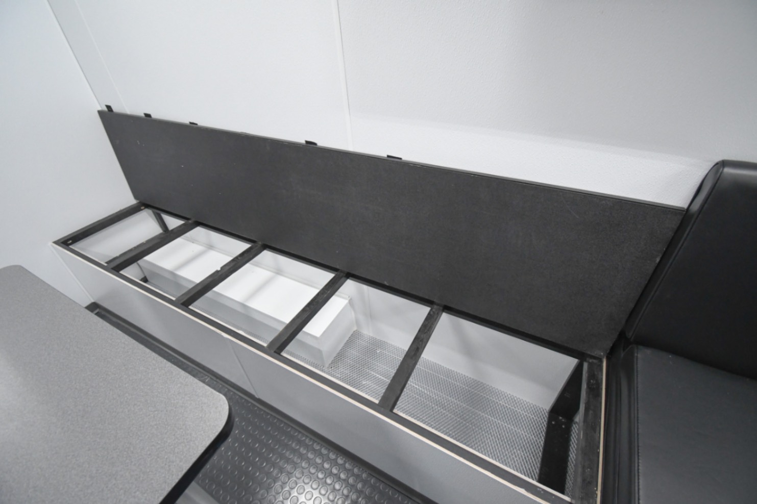 Storage space underneath the benches in the Command 31-4WS MOD's conference/work area. It was made for Winchester, VA.