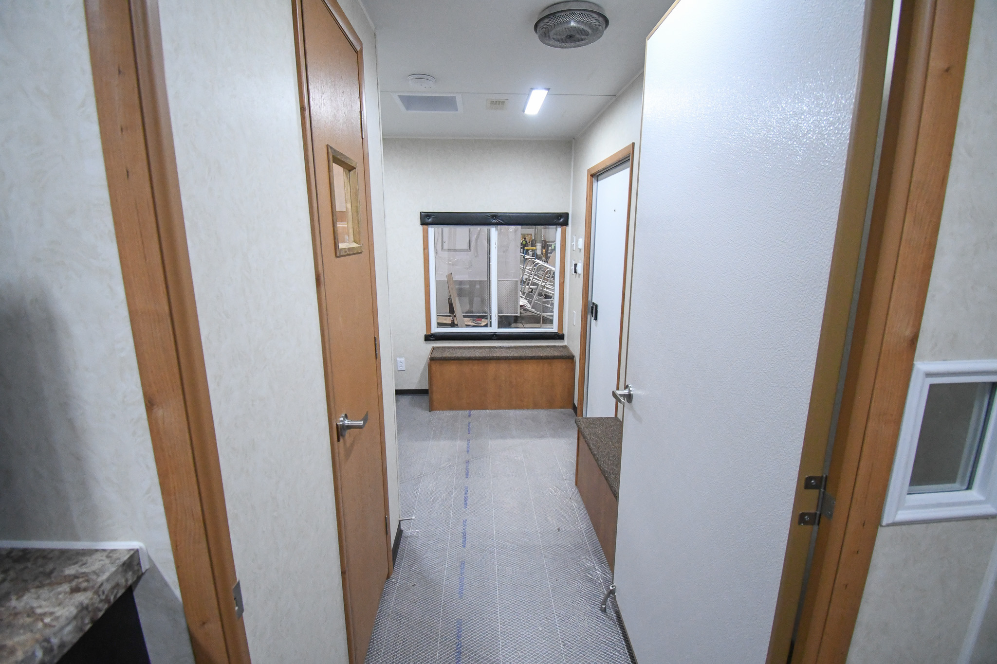 A front-to-back interior view of the unit for Chiloquin, OR. It starts at the door to the bedroom stage.