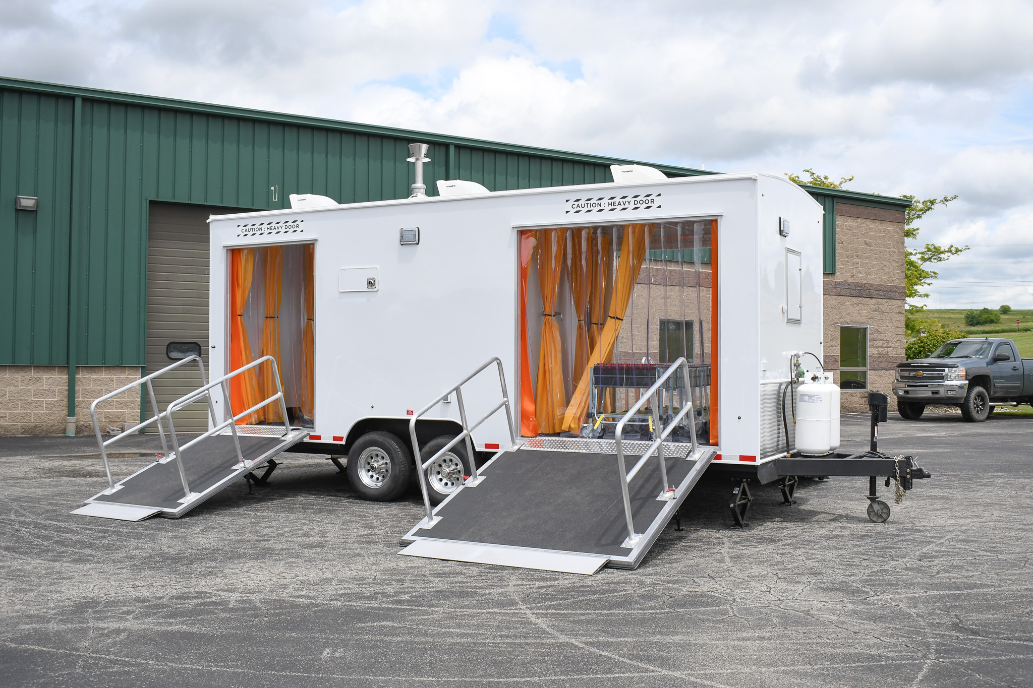An exterior of the unit for Peterson AFB in CO. The ramps are down.