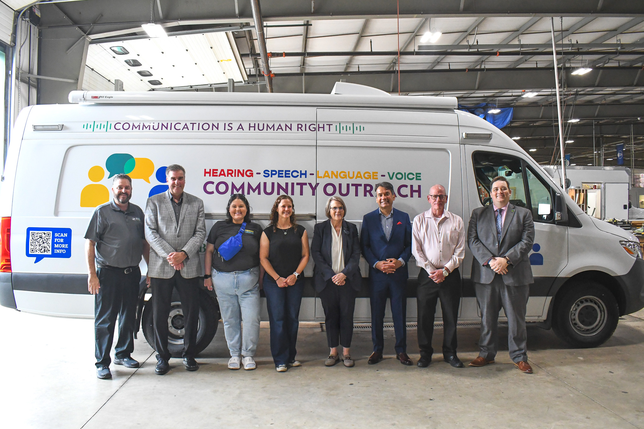 Chris and staff from the Brother's Brother Foundation, the University of Pittsburgh, UPMC, and the Eye & Ear Foundation in front of their van.