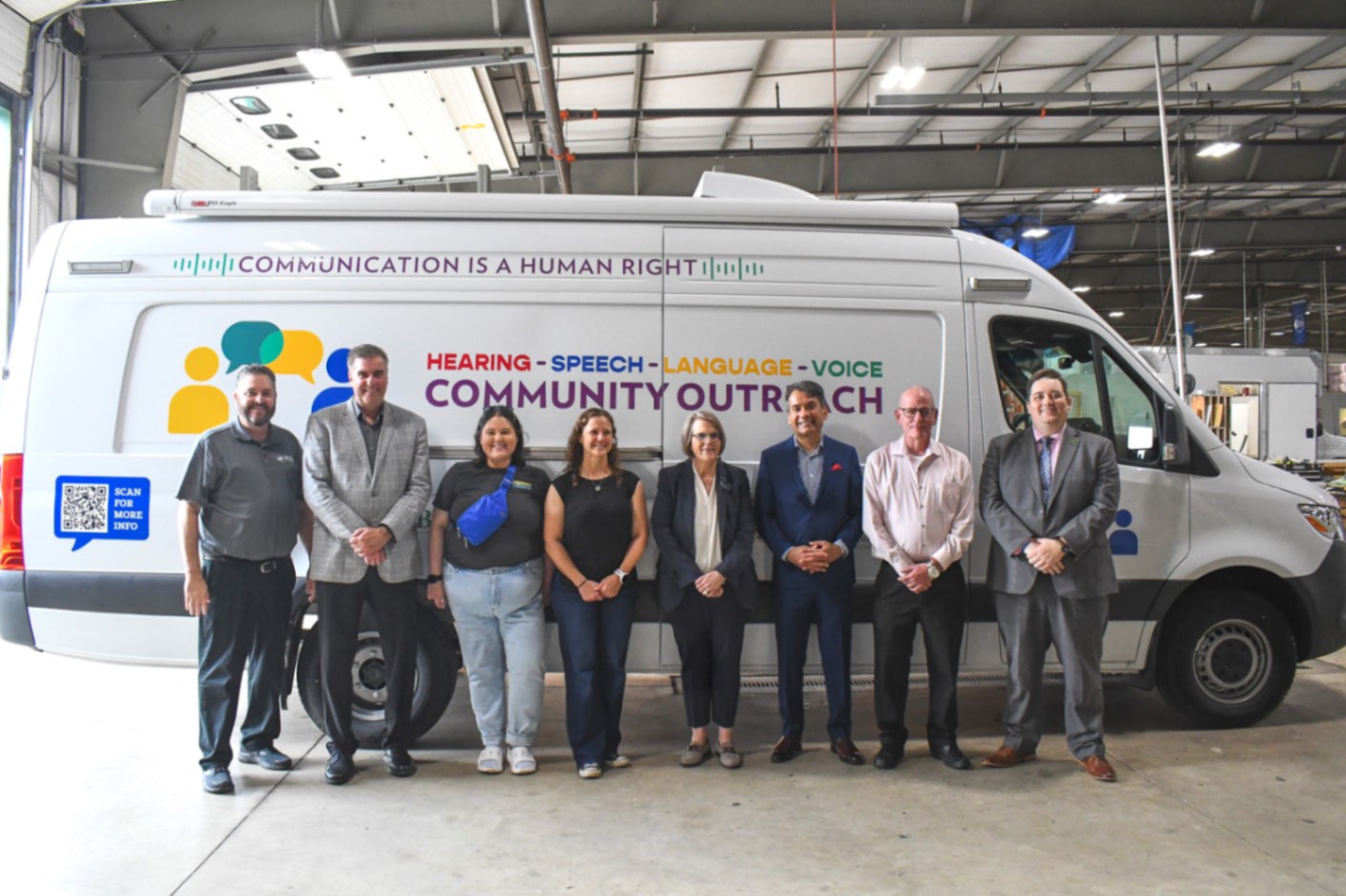 Chris and staff from the Brother's Brother Foundation, the University of Pittsburgh, UPMC, and the Eye & Ear Foundation in front of their Audiology van.