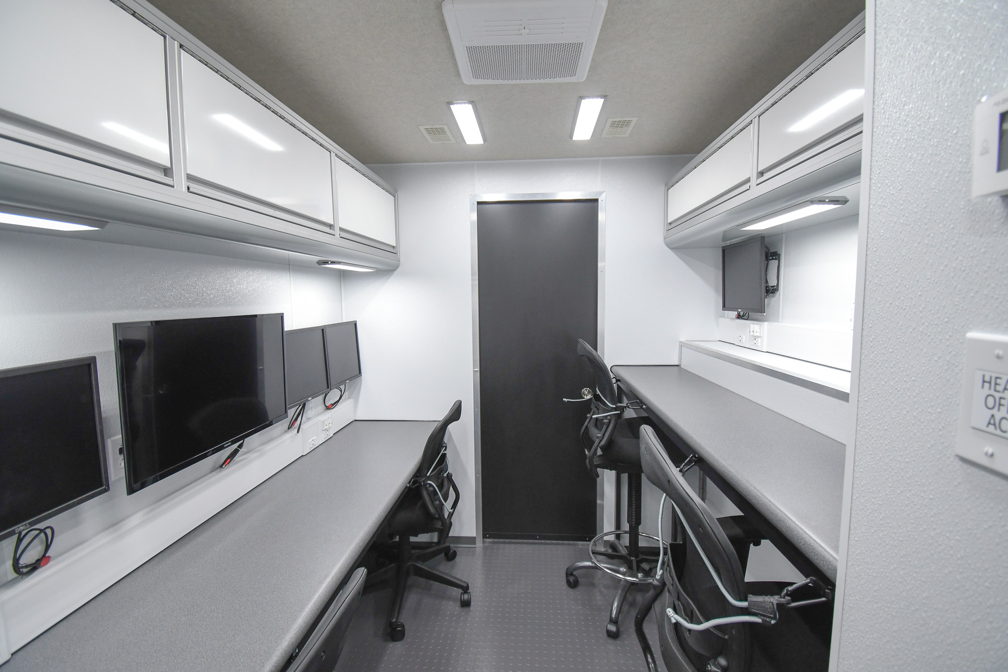 A back-to-front view inside the middle section of the unit for Trenton, NJ. The door to the conference room is closed.
