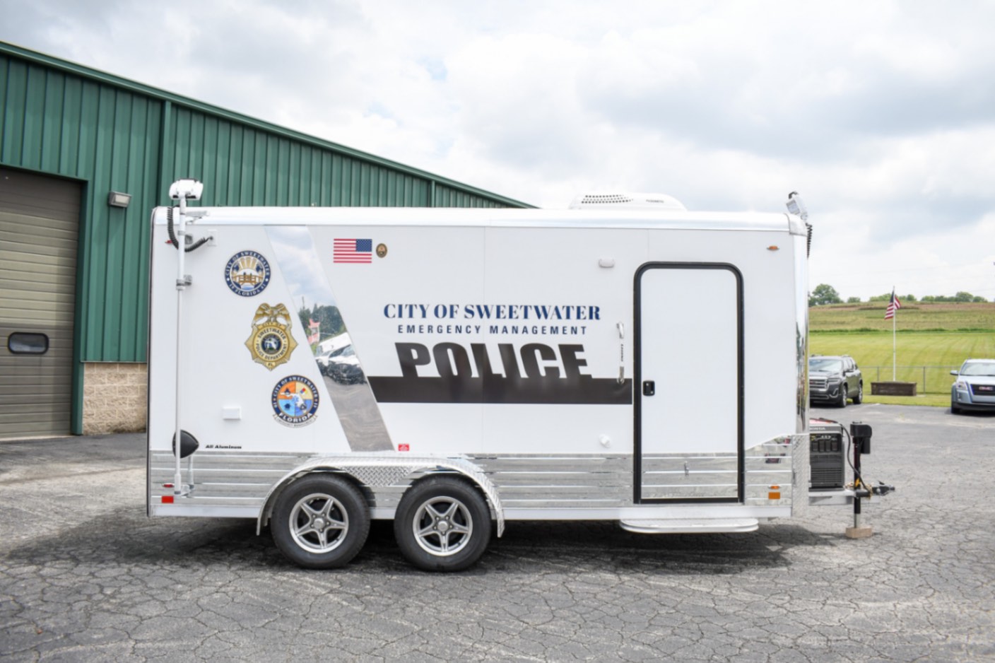 A side view of the Command 20 Cargo Supply trailer made for Sweetwater, FL.