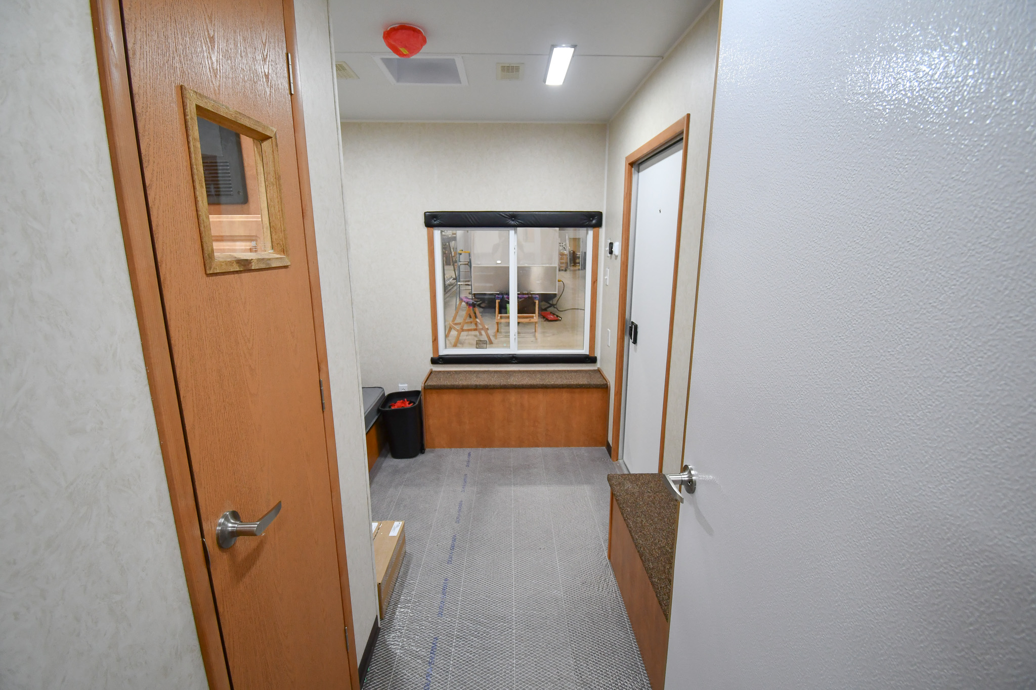 A front-to-back view from the doorway to the bedroom stage inside the unit for Lancaster, TX.