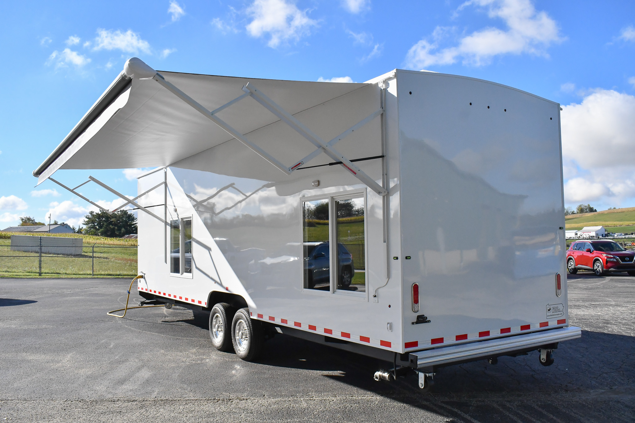 An exterior view of the 35-2Bedroom for Wantagh, NY. The awning is deployed.
