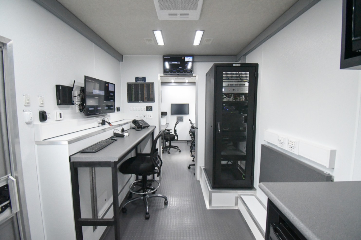 A front-to-back view of the Command 42-5WS FW 2SO made for Sweetwater, FL. It is taken from the doorway entering the exiting the conference room.