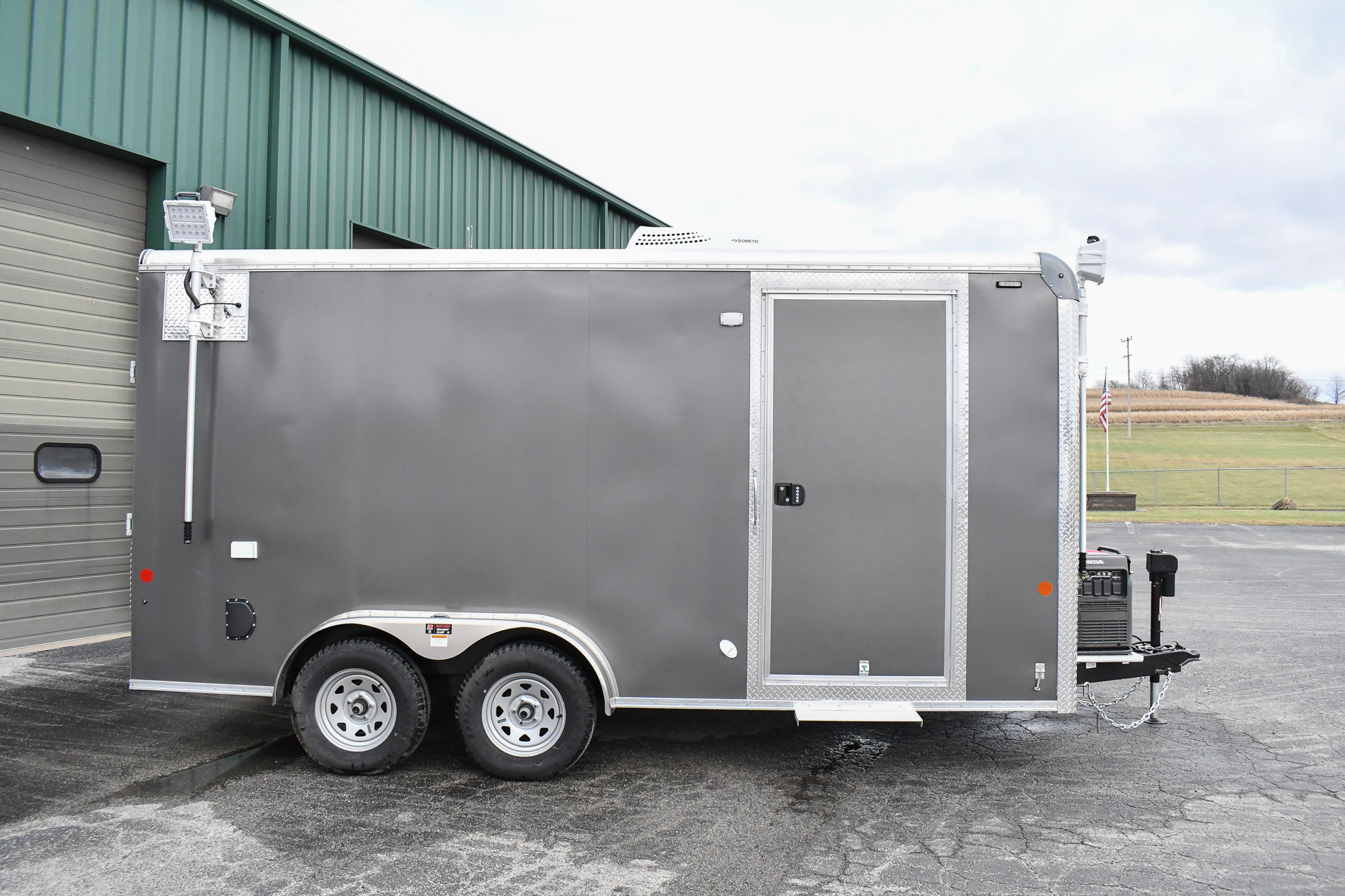 A side view of the Command Cargo 20 for Smithfield, NC. The LED pushup poles are down, and the rear ramp is up.