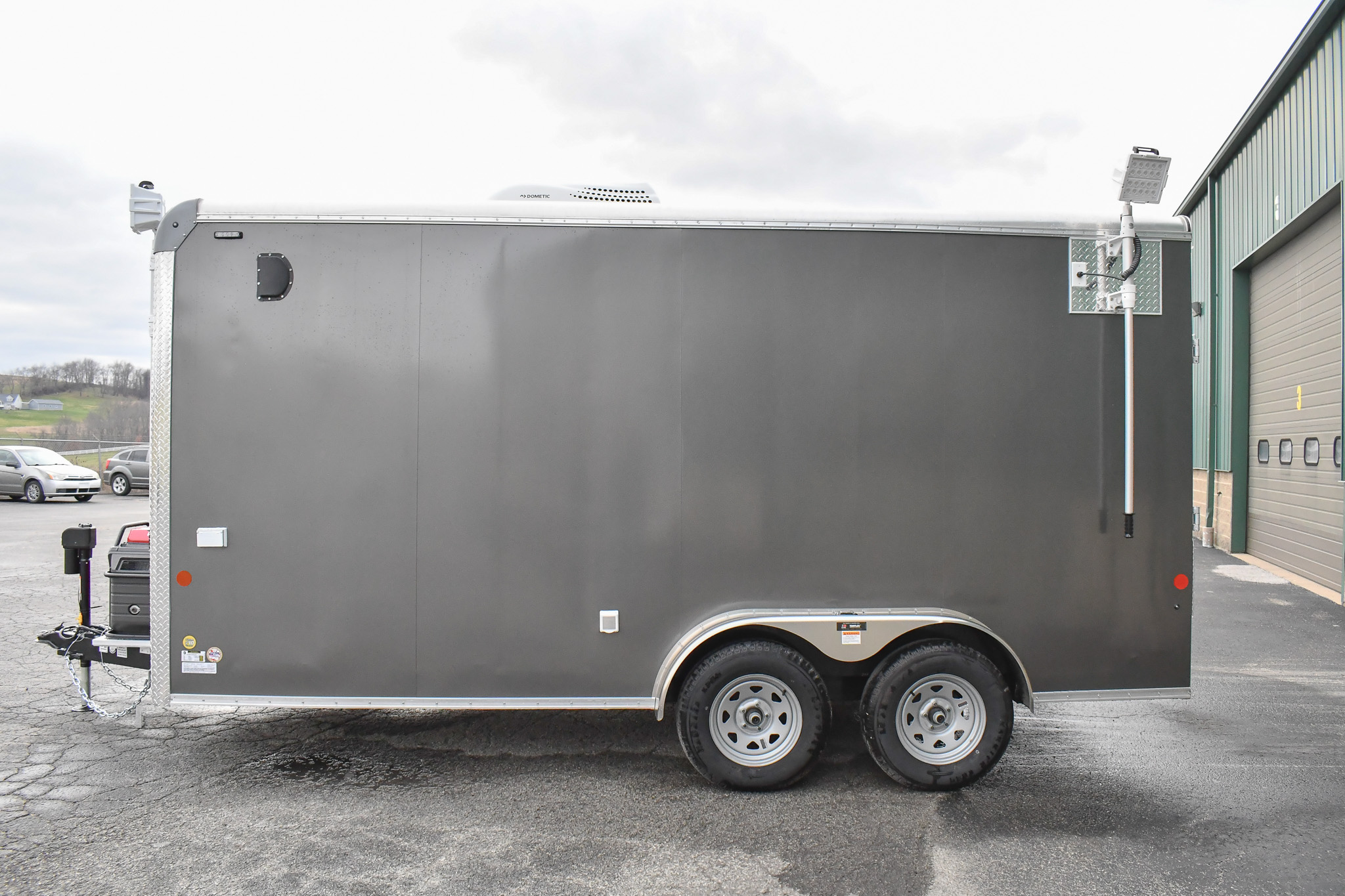 An alternate side view of the Command Cargo 20 for Smithfield, NC. The LED pushup poles are down, and the rear ramp is up.