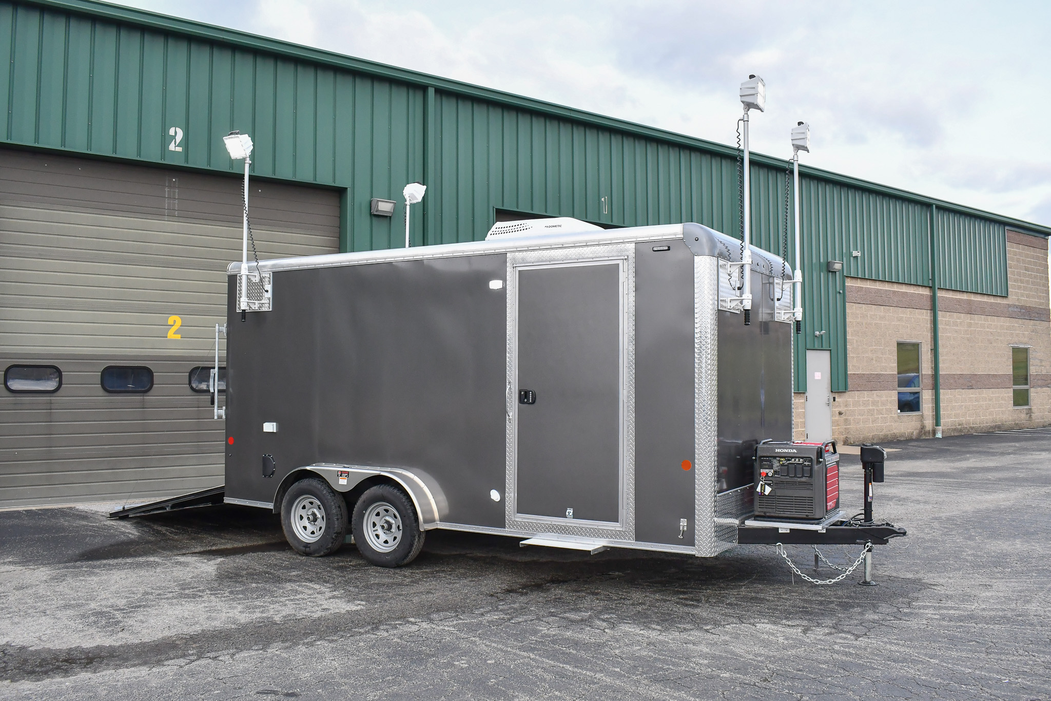 An exterior view of the Command Cargo 20 for Smithfield, NC. The LED pushup poles are up, and the rear ramp is down.