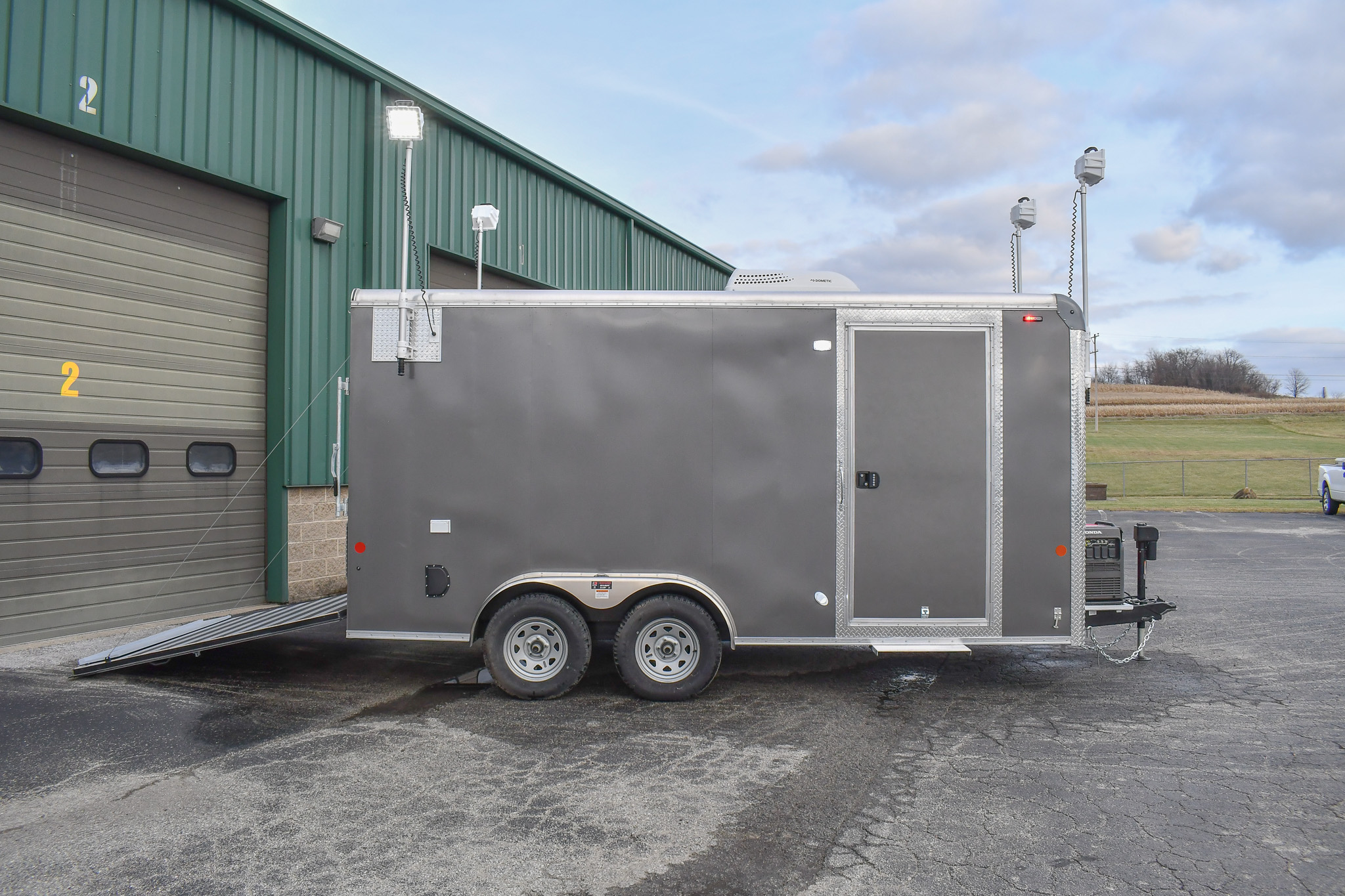A side view of the Command Cargo 20 for Smithfield, NC. The LED pushup poles are up, and the rear ramp is down.