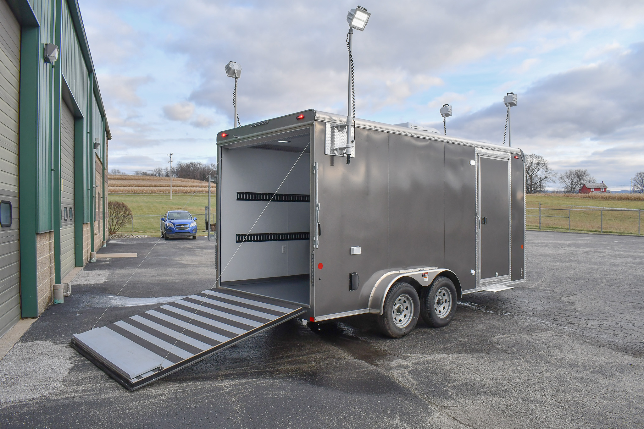 An exterior view of the Command Cargo 20 for Smithfield, NC. The LED pushup poles are up, and the rear ramp is down.