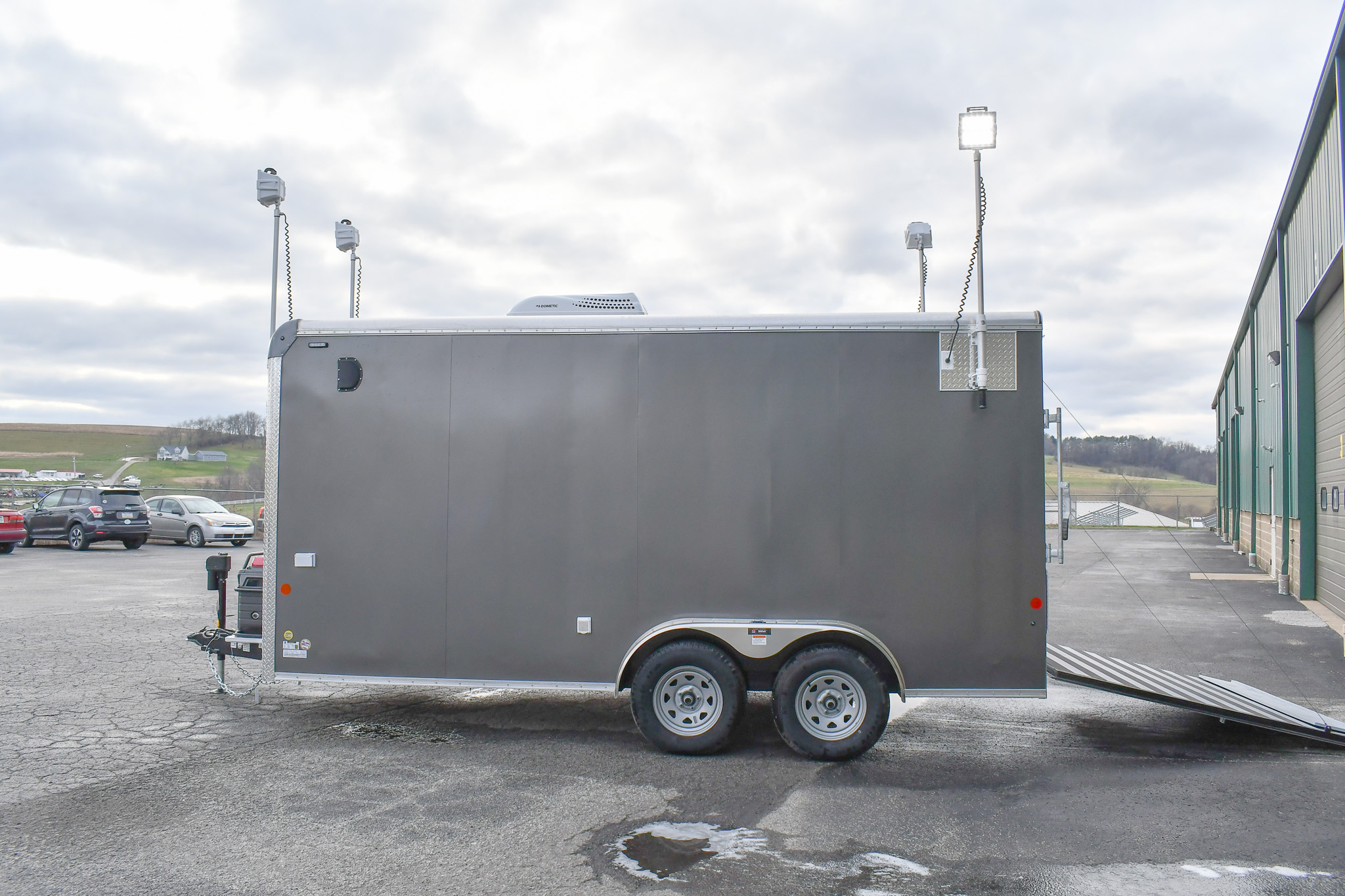 An alternate side view of the Command Cargo 20 for Smithfield, NC. The LED pushup poles are up, and the rear ramp is down.