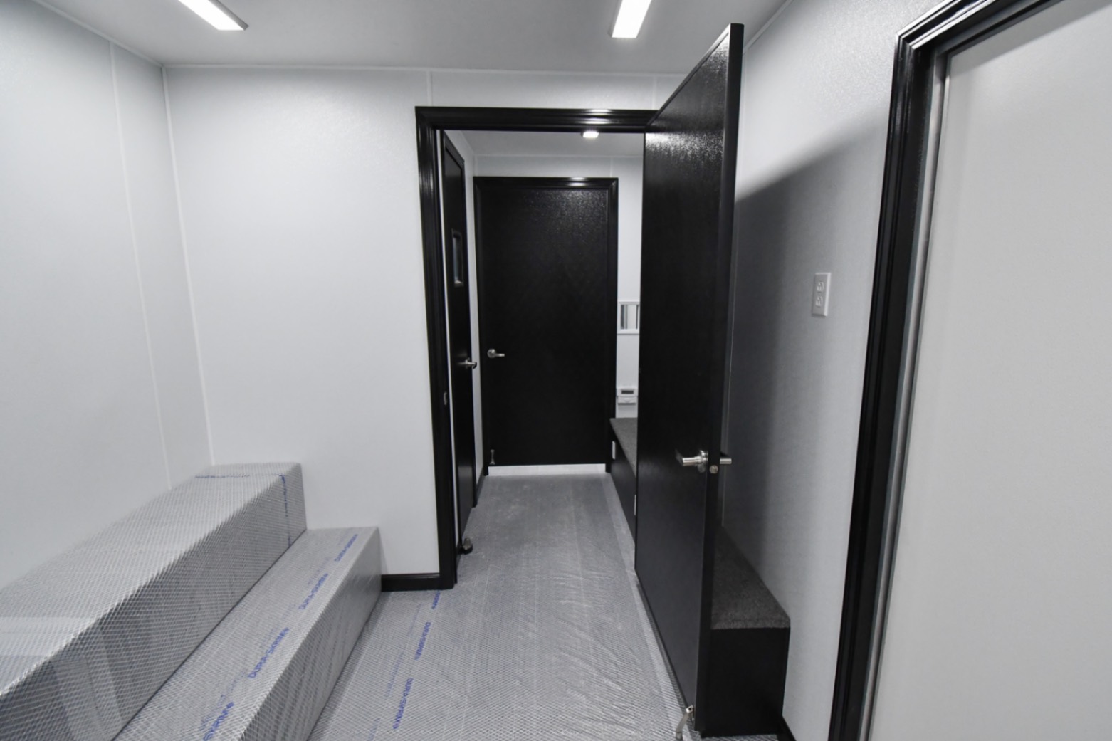 A back-to-front view inside the 31Bleacher Mod made for Burien, WA. The door to the first room is closed.